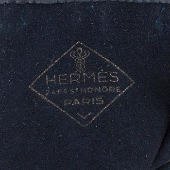 HERMÈS, a pair of blue leather gloves.