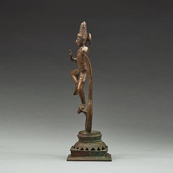 A bronze scupture of Krishna who has konkured the five headed serpant, India, early 20th Century.