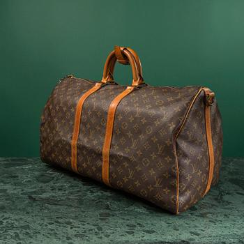 A monogram canvas weekendbag "Keepall 55 Bandoulière " by Louis Vuitton.