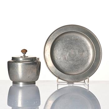 Josef Frank, a four-piece pewter tea set and a plate, model "A2330", Firma Svenskt Tenn, Stockholm 1946 (plate 1929).