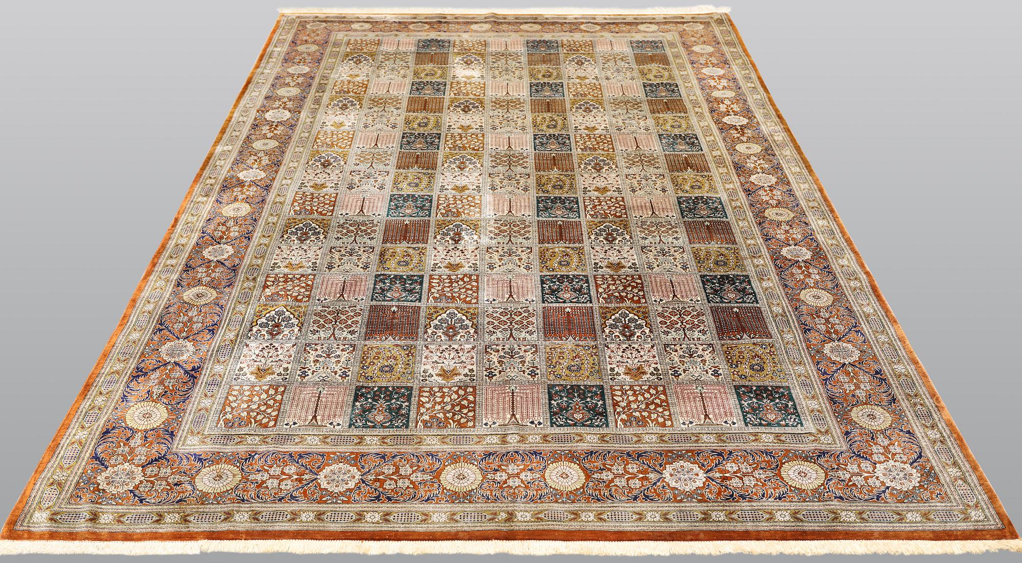 A silk Ghom carpet, 296 x 194 cm.