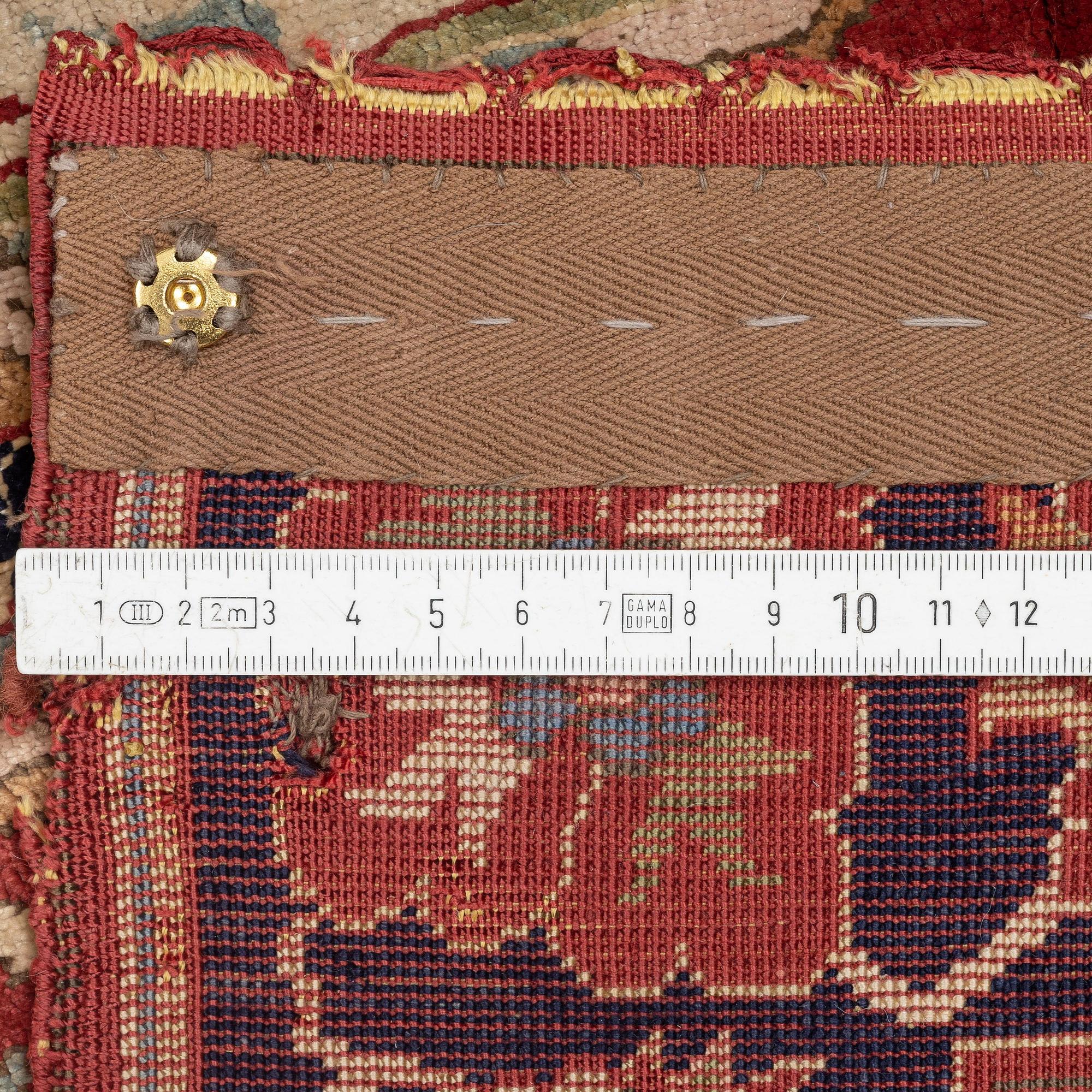 An antique Anatolian silk rug, c. 183 x 120 cm.