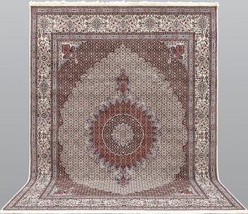 A part silk Moud carpet, approximately 350 x 252 cm.
