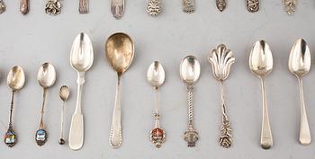 A collection of silver of 57 pcs, i.a souvenir spoons, 20th century. Total weight 1073 g.