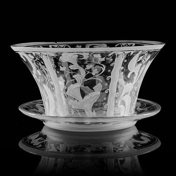 Simon Gate, a Swedish Grace engraved glass bowl with stand, Orrefors 1930, model 147, engraved by Karl Rössler.