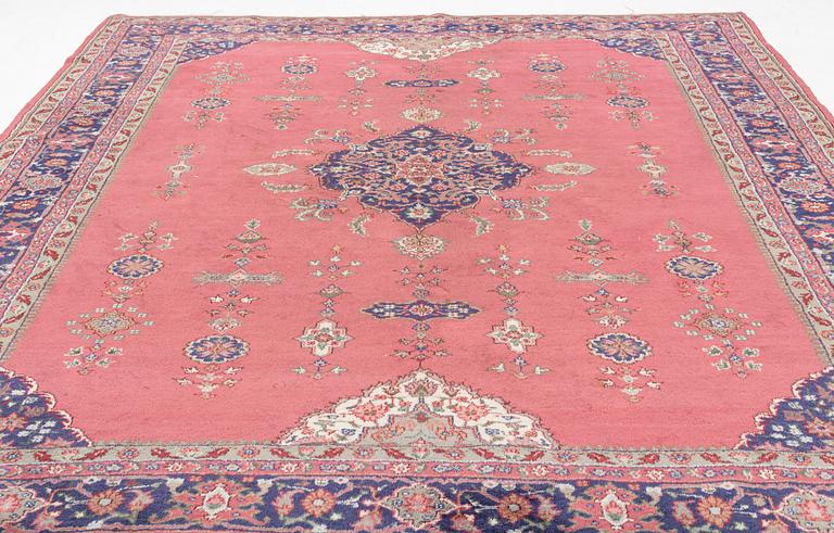 An oriental/eastern European carpet, c. 355 x 275 cm.