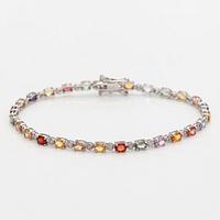 An 18K white gold bracelet with multi-colour sapphires and diamonds bracelet.