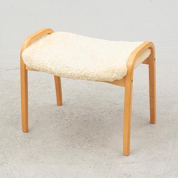 Yngve Ekström, a 'Lamino' armchair and ottoman, Swedese, 2002.