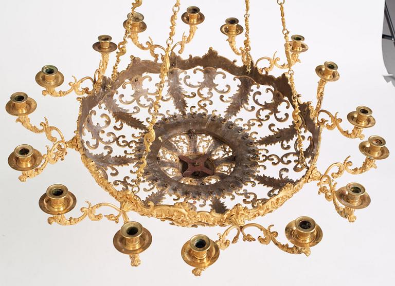A rococo-revival gilt-brass sixteen-light chandelier, mid 19th century.