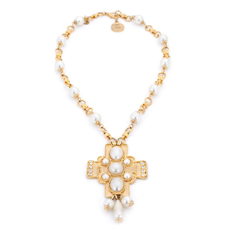 CHANEL, a gold colored necklace with decorative white pearls.