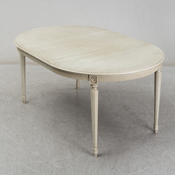 A dining table and six chairs, Gustavian style, second half of the 20th century. One leaf included.