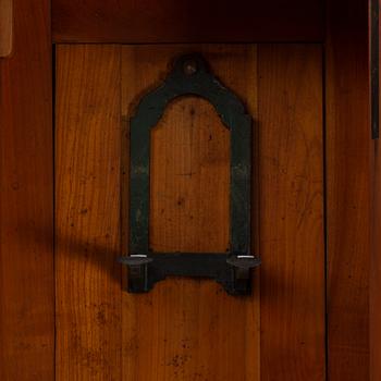 A walnut long case clock, from around the year 1900.