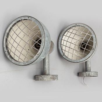 A pair of industrial wall lamps.