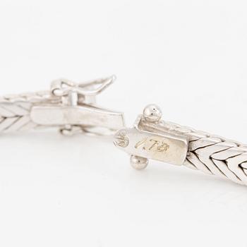 Bracelet in 18K white gold with brilliant-cut diamonds.