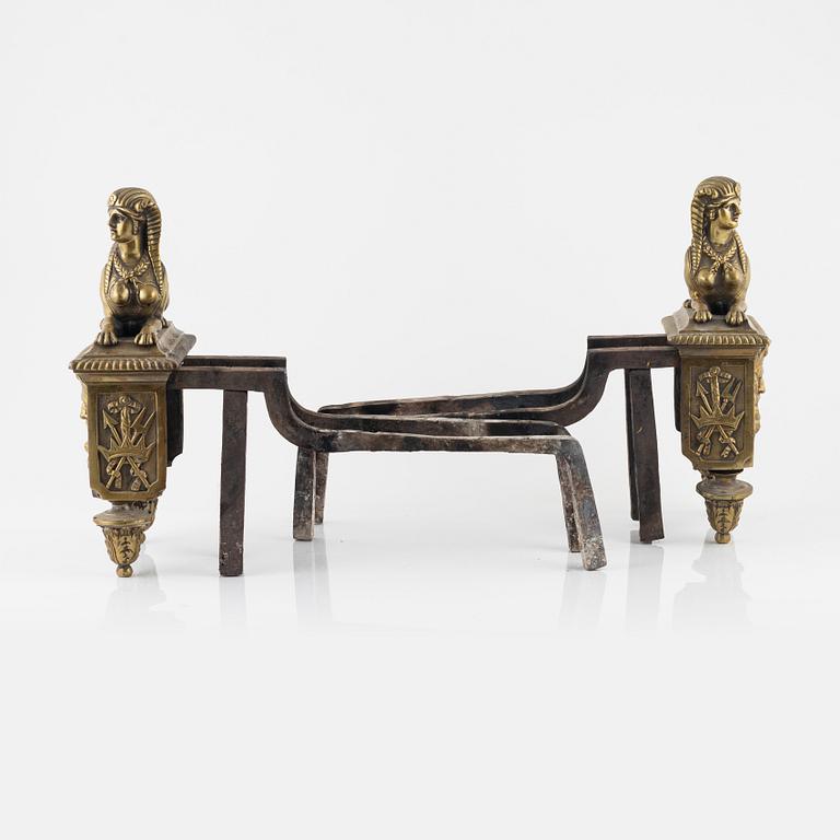 A pair of French 19th century bronze fire dogs.