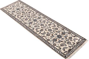 A runner carpet, Nain, part silk, c. 311 x 79 cm.