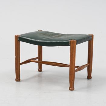 A model 686 stool by Josef Frank for Firma Svenskt Tenn.