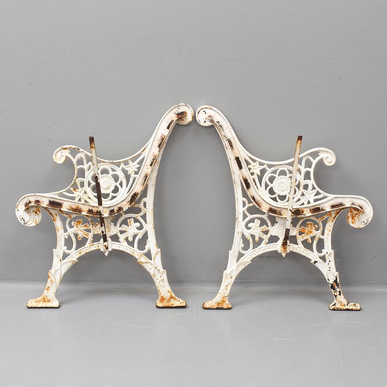 A pair of ends for a garden sofa, cast iron, 20th century.