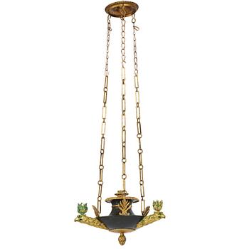 207. An Empire ormolu and patinated bronze four-light chandelier, Stockholm, early 19th century.