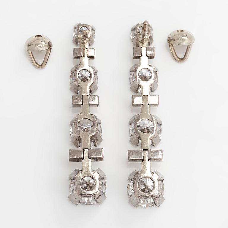 A pair of 18K white gold earrings, set with brilliant-cut diamonds totalling approx. 5.92 ct. Westerback, Helsinki 1973.