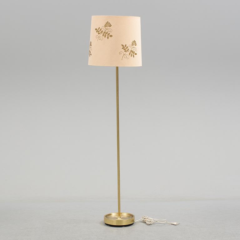 A brass floor lamp by Fagerhult.