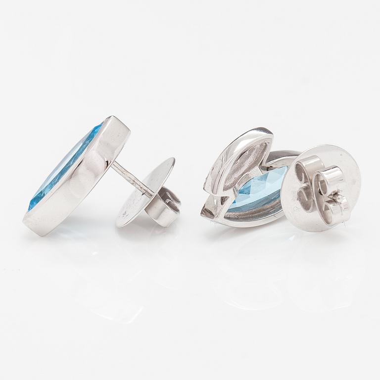 A pair of 14K white gold earrings with topazes and diamonds ca. 0.10 ct in total.