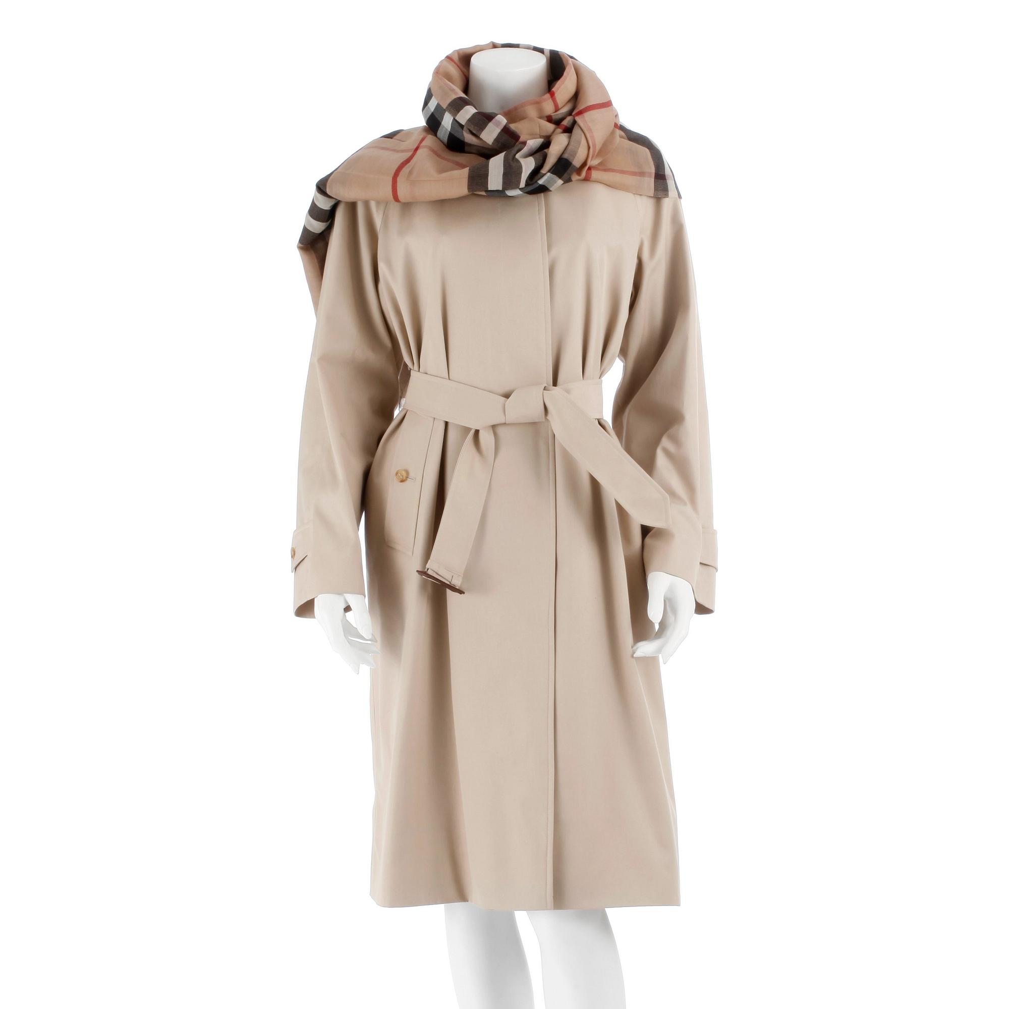 BURBERRY, a beige cotton blend trench coat and a shawl.