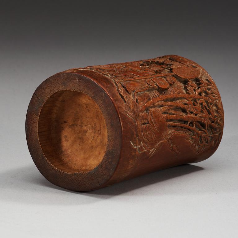 A carved bambu brush pot, late Qing dynasty.