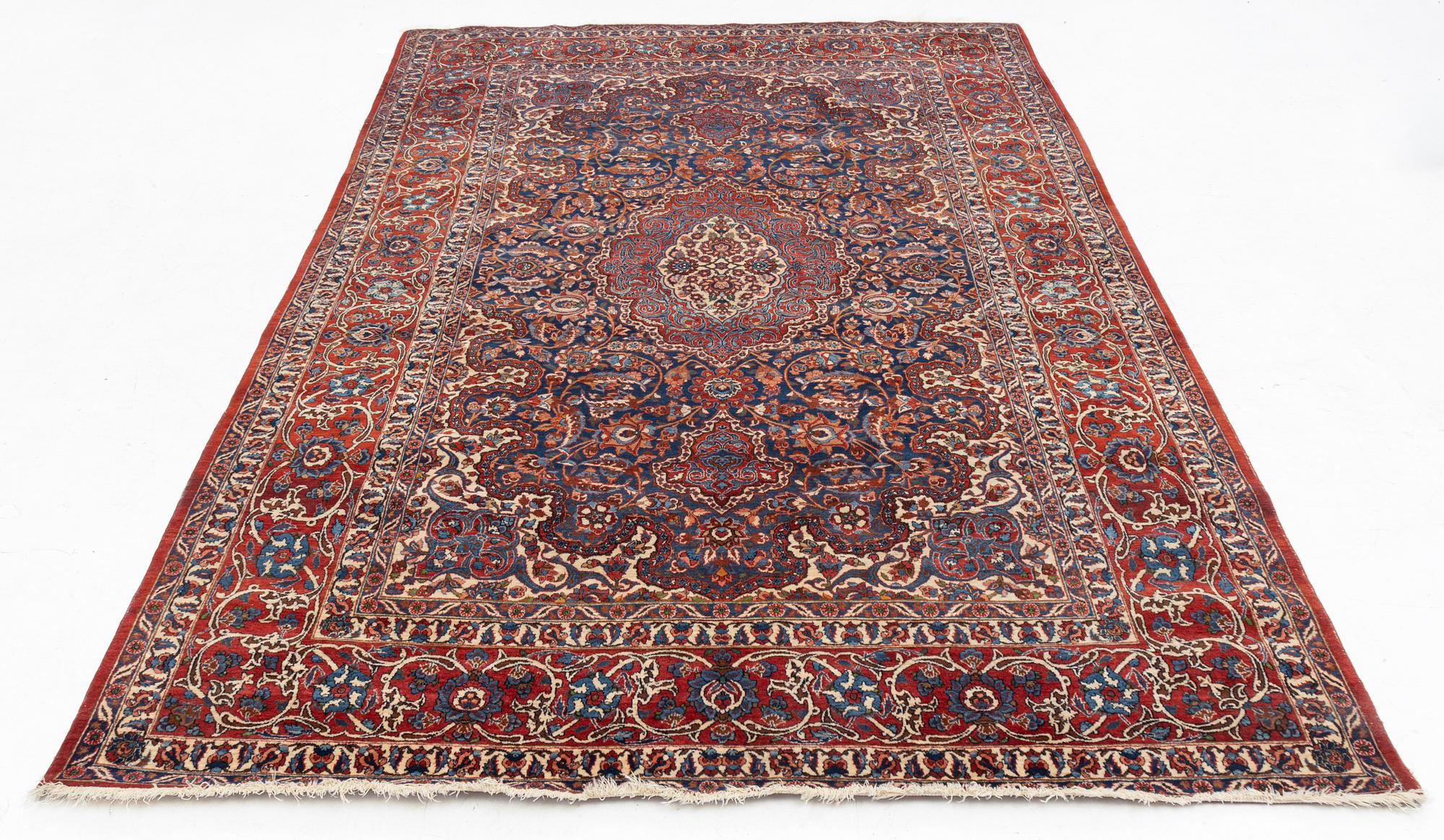 A semi-antique Isfahan rug, central Persia, c. 305 x 205 cm.