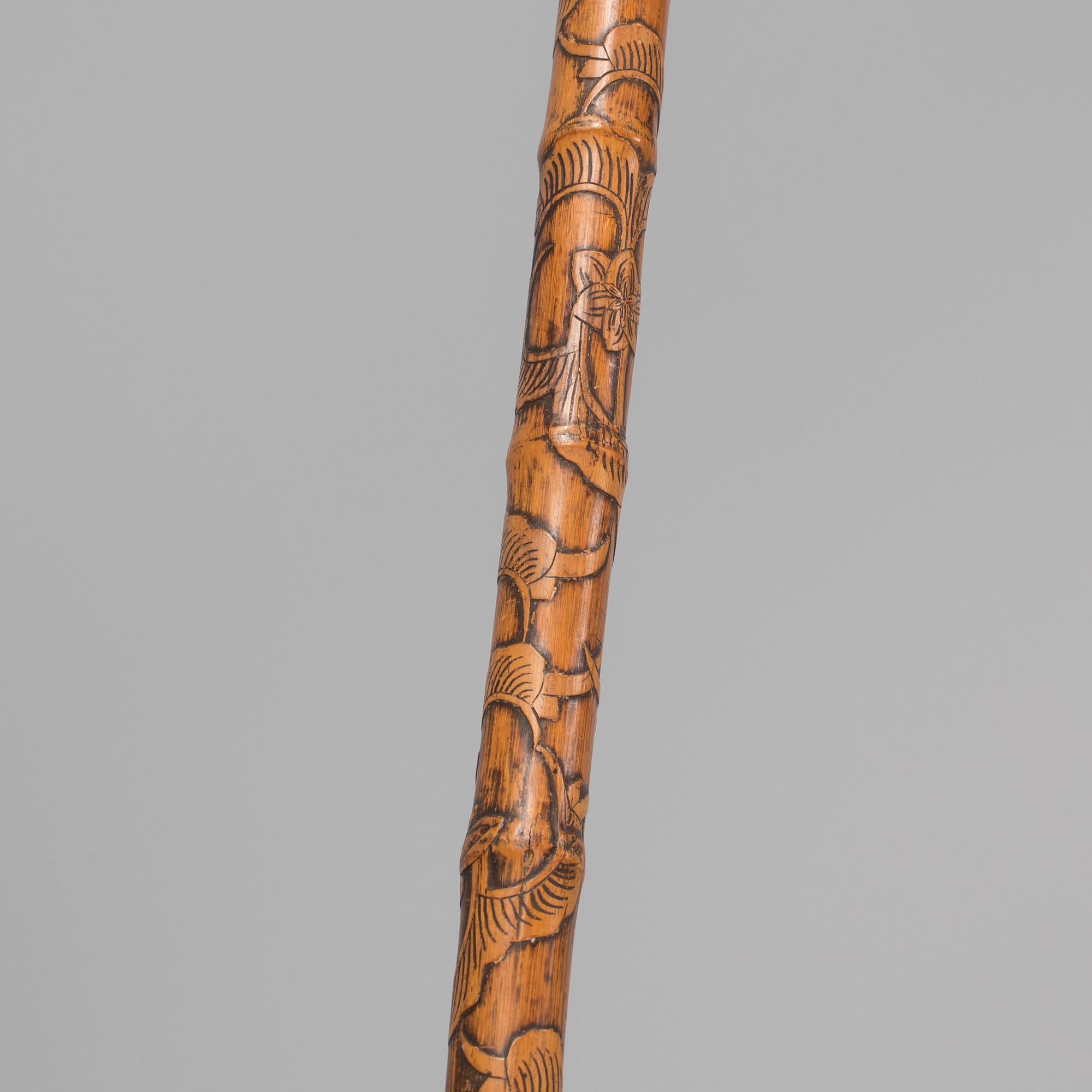 A CHINESE BAMBOO WALKING STICK, latter part of the 19th century.