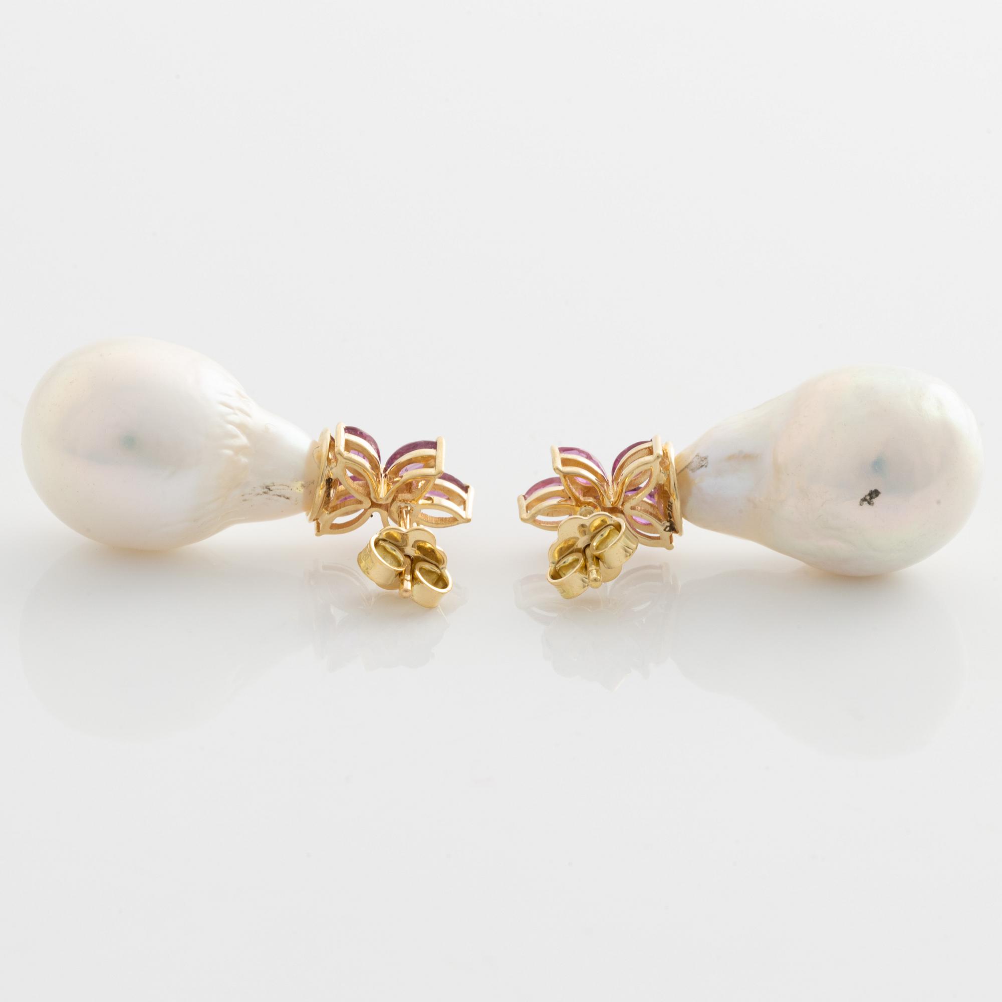 Earrings with cultured baroque freshwater pearls and pink sapphires.
