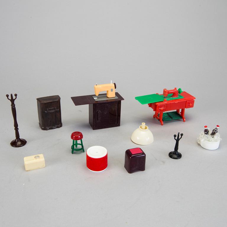 A lot of 26 pieces of plastic doll house furniture mostly by A Renwal products USA first half of the 20th century.