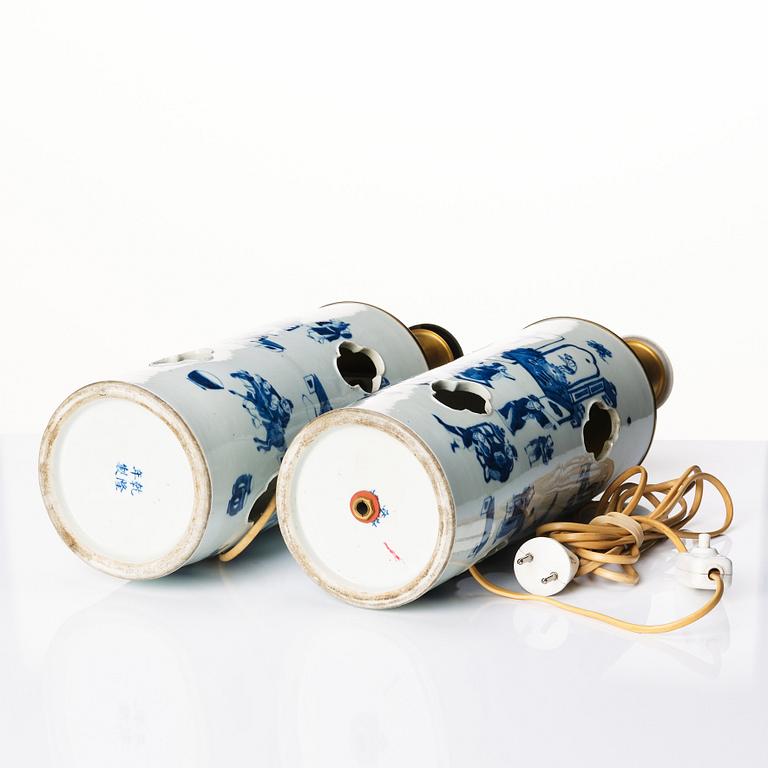 A pair of blue and white vases made in to lamps, late Qing dynasty, 19th Century.