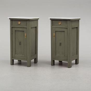 a pair of early 20th century painted bedside tables.