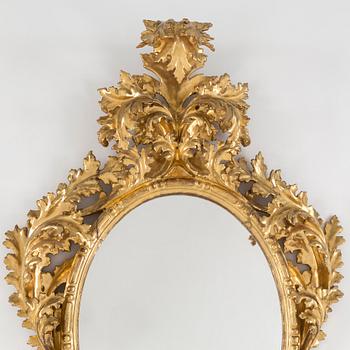 A 20th century Baroque style mirror.