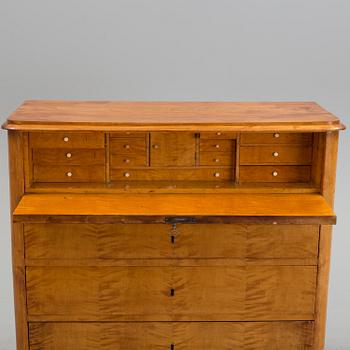 A second half of the 19th century birch veneered chest of drawer.