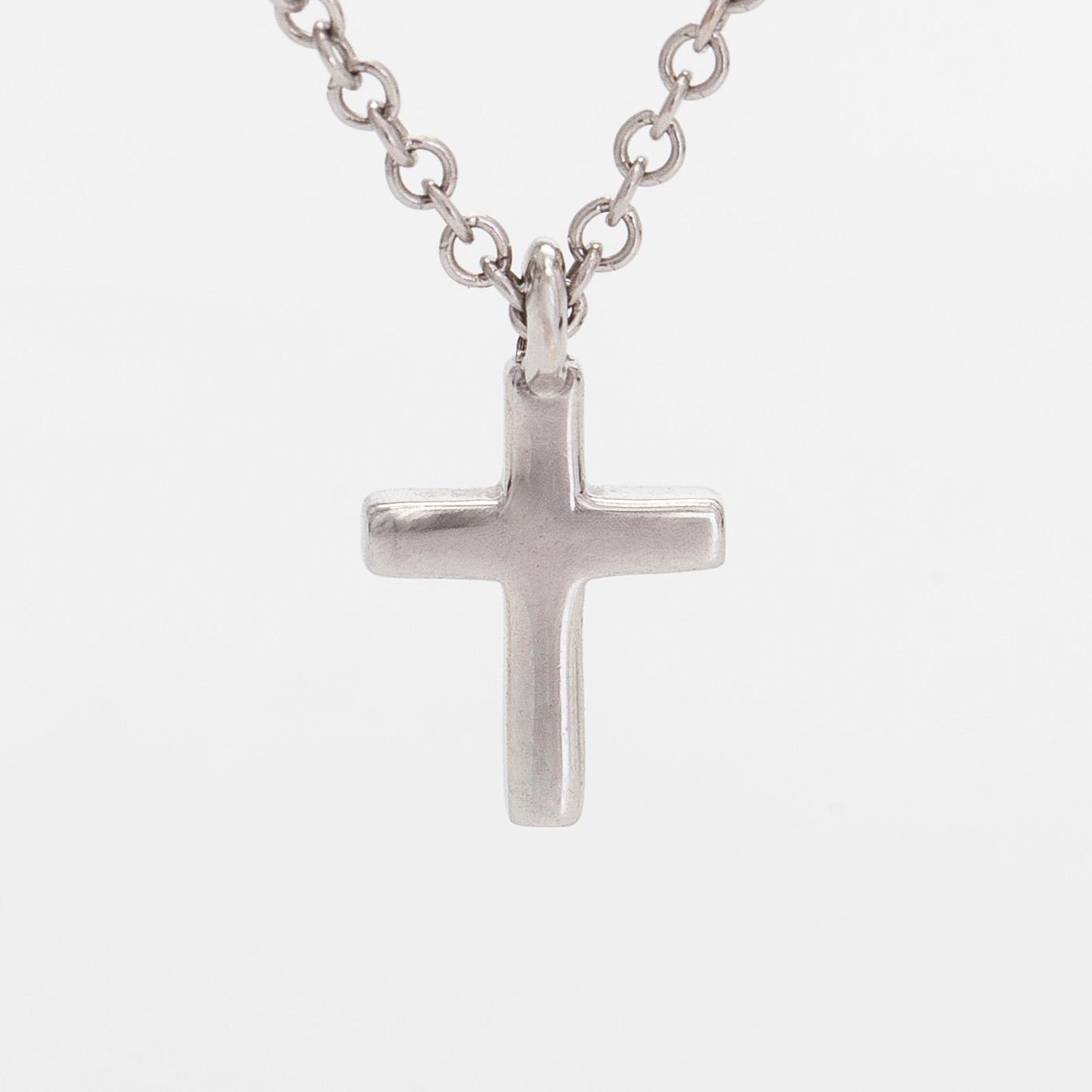 Tiffany & Co, an 18K white gold "Metro Cross" necklace with diamonds.