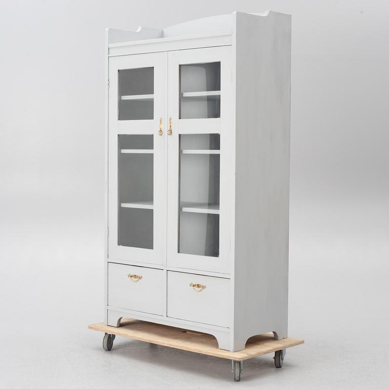 Display cabinet, early 20th century.