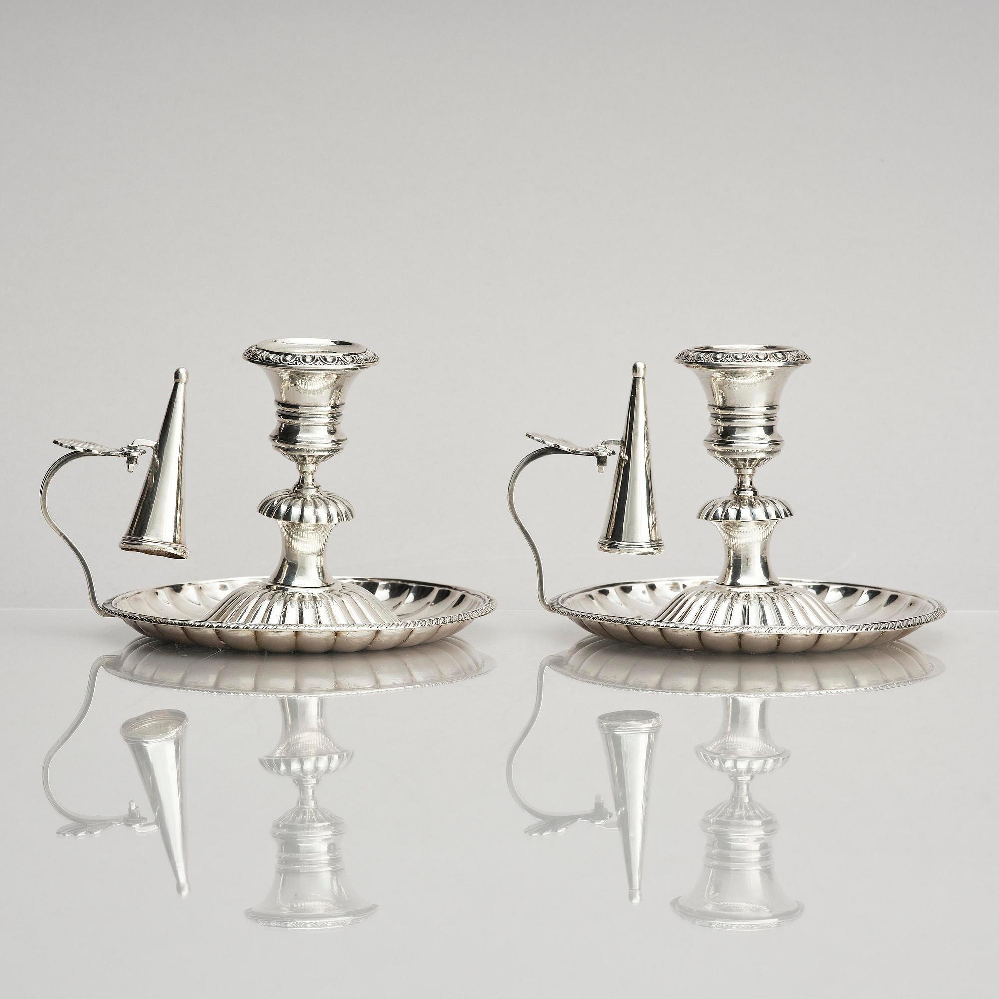 A pair of Swedish 19th century silver chamber-candlesticks, marks of Adolf Zethelius, Stockholm 1831.