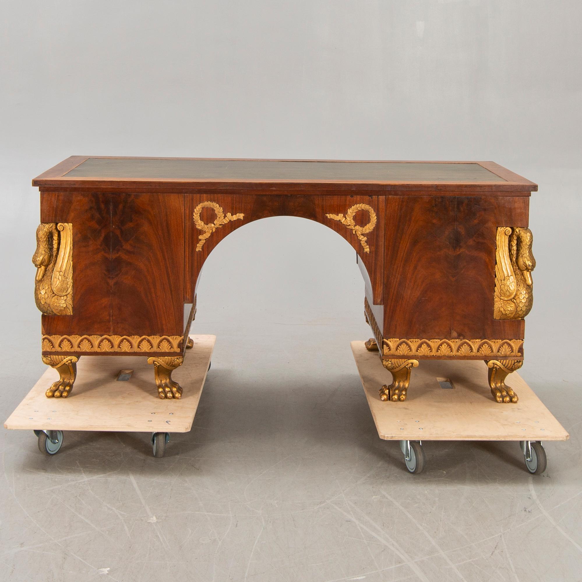 An Empire style mahogany desk 20th century.