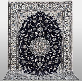A carpet, Nain, part silk, ca 310 x 205 cm.
