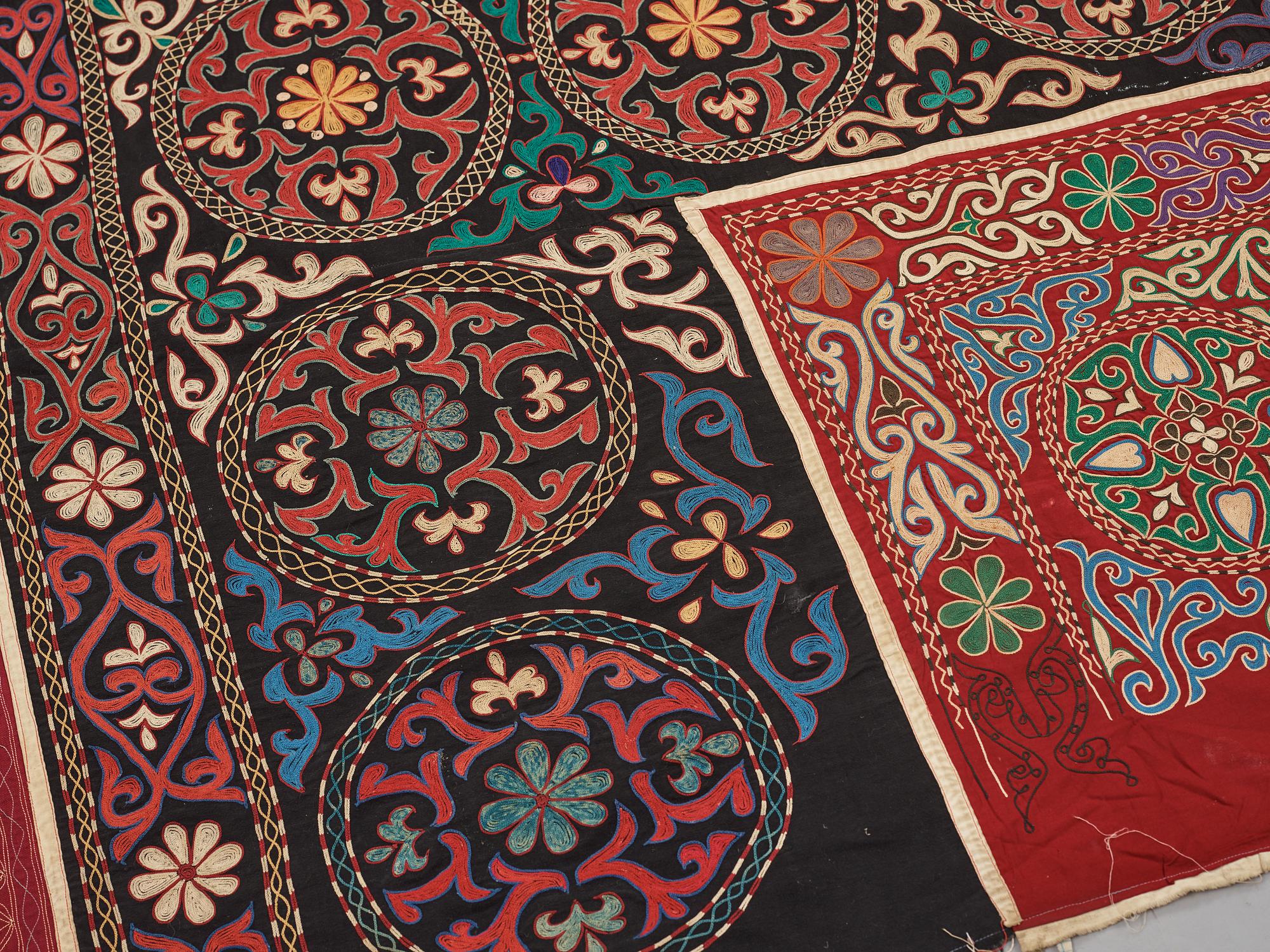 A Suzani textile, ca 247 x 128 cm.