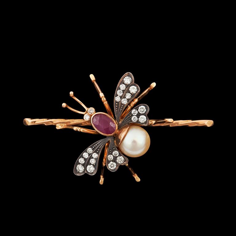 A  cultured pearl, ruby and diamond brooch in the shape of a fly.