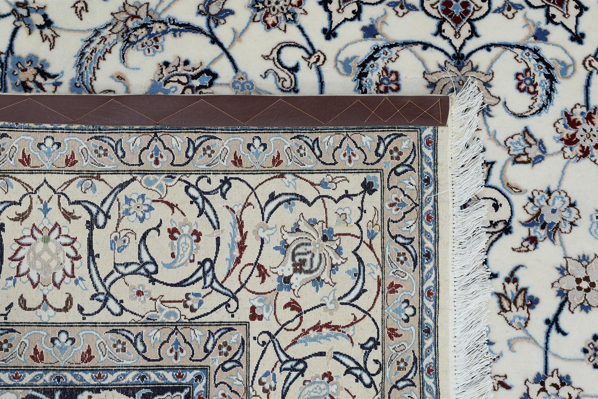 A Nain carpet, part silk, so called 6LAA, approximately 279 x 200 cm.