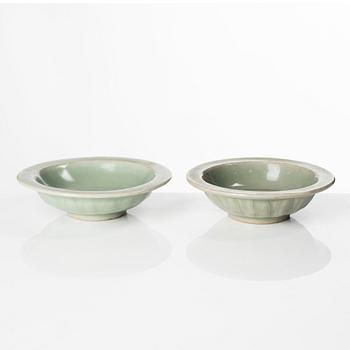 Two celadon glazed double fish dishes, Ming dynasty (1368-1644).