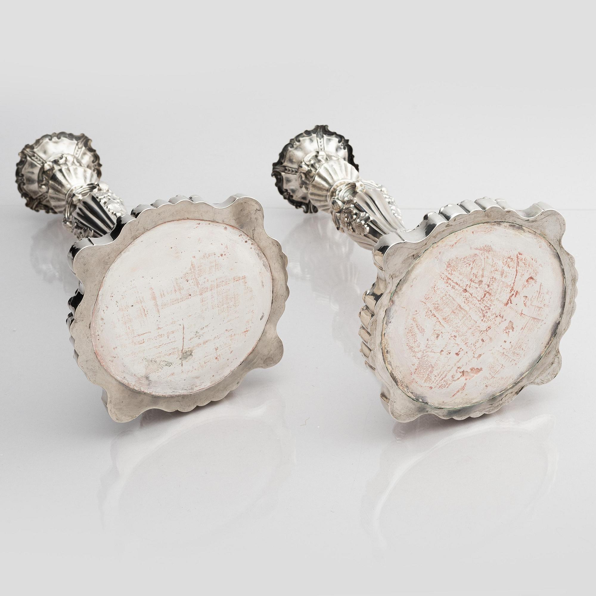 A pair of silver candlesticks, marks Gustaf Möllenborg, Stockholm 1845.