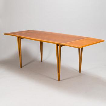 A mid-20th century dining table.