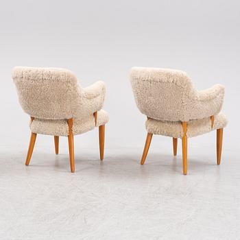 A pair of 'Lilla Sällskapet' armchairs by Carl Malmsten, second half of the 20th Century.