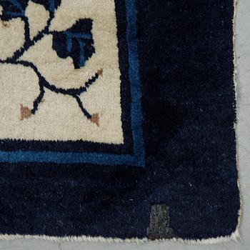 A carpet, a semi-antique China, ca 348,5-350 x 279,5-282,5 cm.