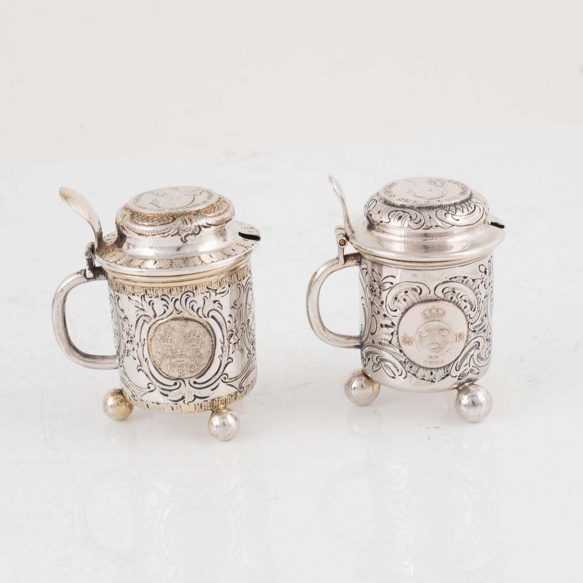 Candlesticks, a pair, Gustaf Möllenborg, Stockholm 1844, and two salt cellars including CG Hallberg, Stockholm 1897.